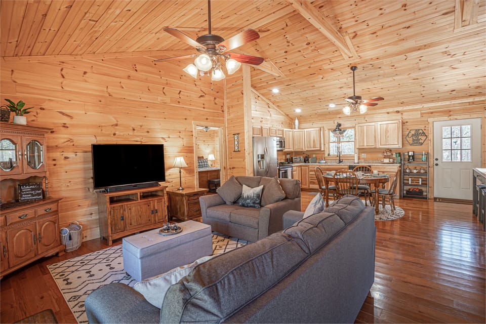 Spacious living room with pull out sofa sleeper and a cozy feel.