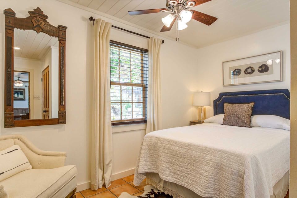 A warm and soft double bed in the second bedroom provides peaceful sleep for two, draped in fresh linens.