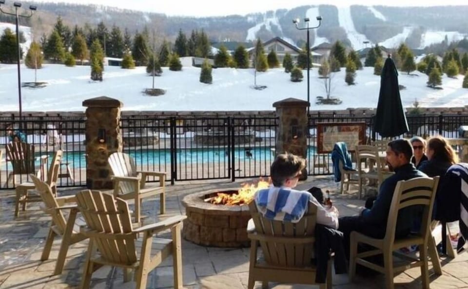 poolside patio with firepits