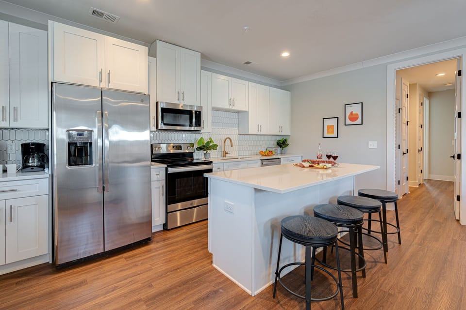 Fully Equipped Kitchen stocked with basic cooking essentials and stainless-steel appliances.