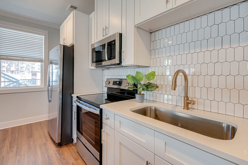 Fully Equipped Kitchen stocked with basic cooking essentials and stainless-steel appliances.