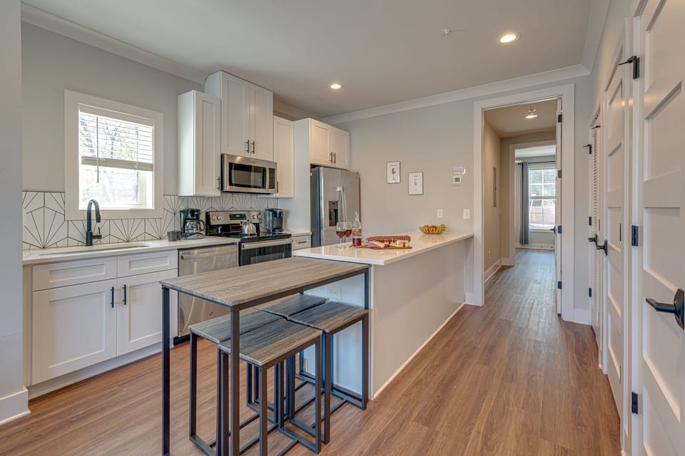 Fully Equipped Kitchen stocked with basic cooking essentials and stainless-steel appliances.
