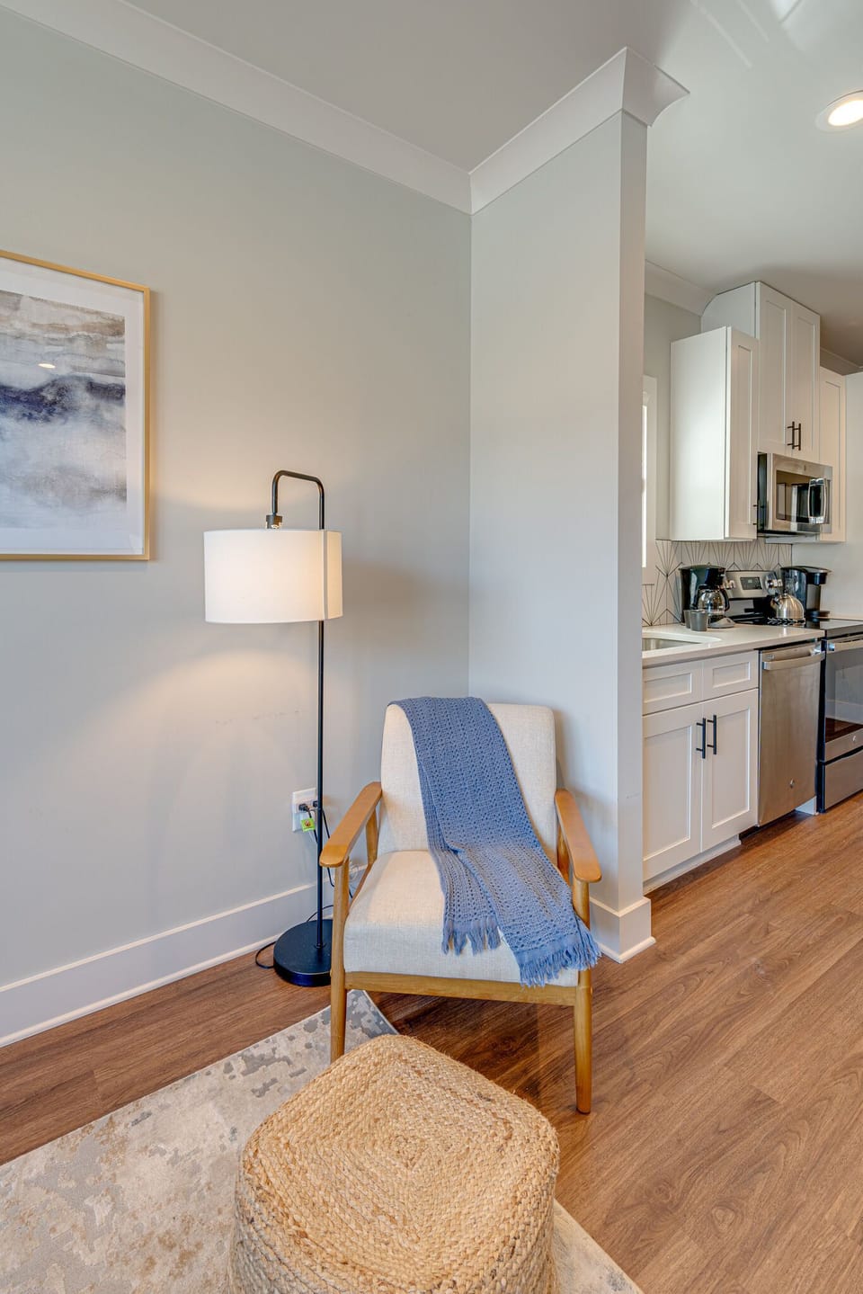 Modern Living Space featuring designer furnishings and a flat-screen SMART TV overlooking the fully equipped kitchen.