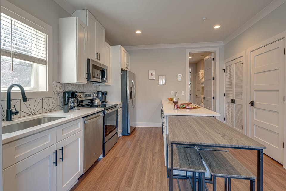 Fully Equipped Kitchen stocked with basic cooking essentials and stainless-steel appliances.