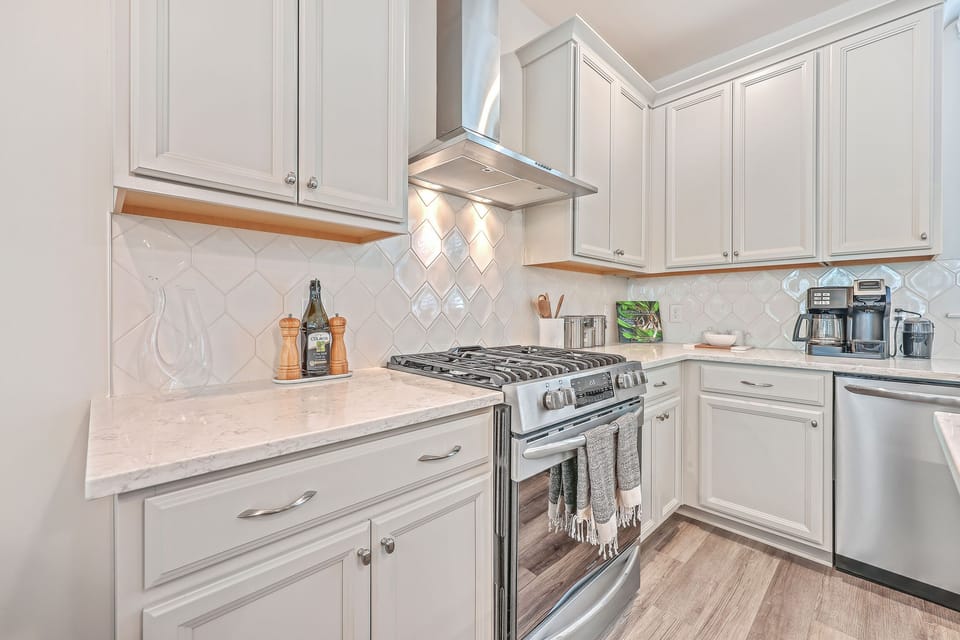 High end range, large refrigerator, microwave, and high efficiency dishwaher