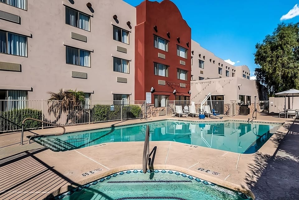 Dive into sunshine with a sparkling pool and loungers.