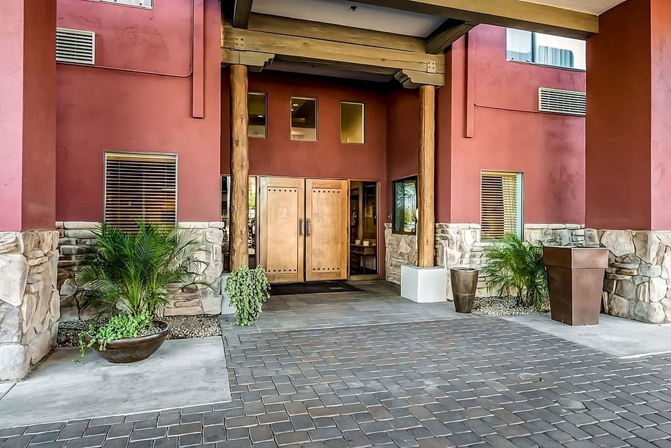 Arrive effortlessly under the covered entry with desert charm.