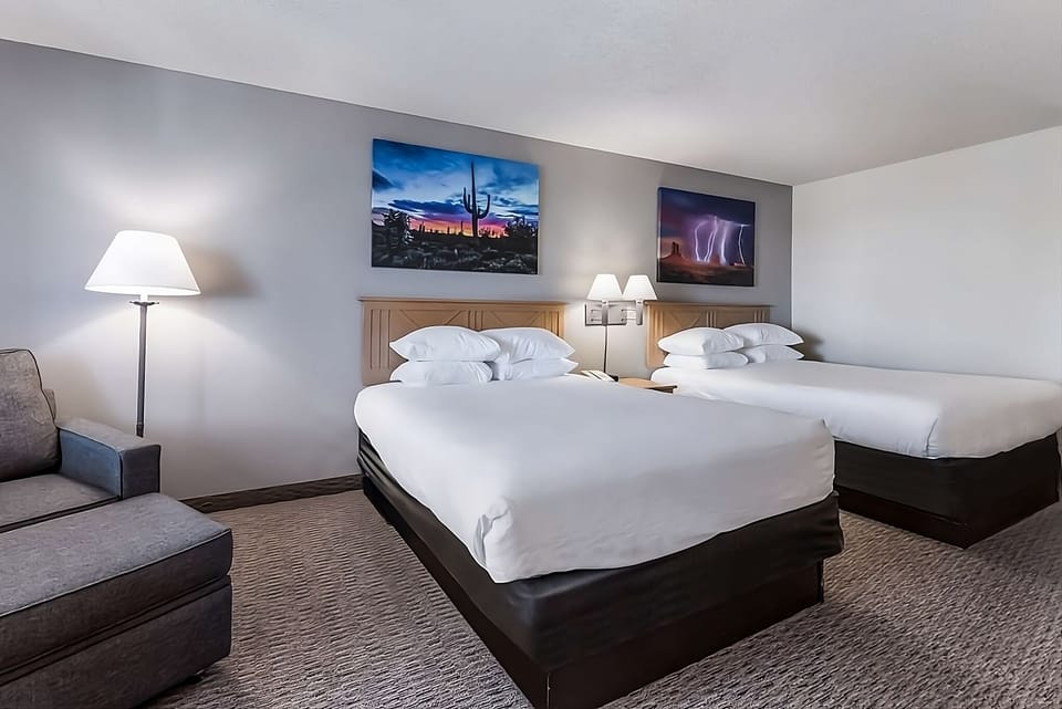 Stretch out on two plush beds under warm, calming light.