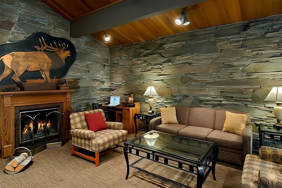 Sink into cozy seating by the glowing fireplace after exploring.