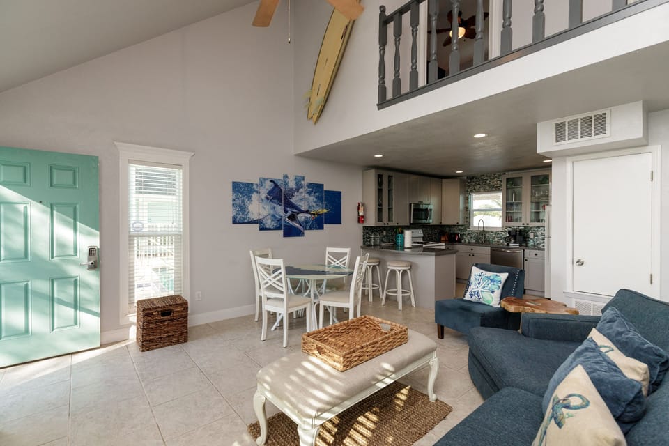 You'll love this bright open-concept space where coastal blues meet modern comfort, perfect for relaxing after your beach adventures.