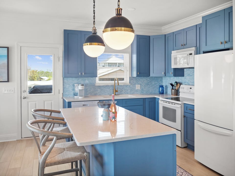 Newly renovated kitchen with large kitchen Island, seats 3 comfortably.