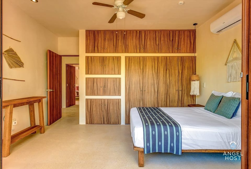 Bedroom 2 with a plush queen bed & ample closet space