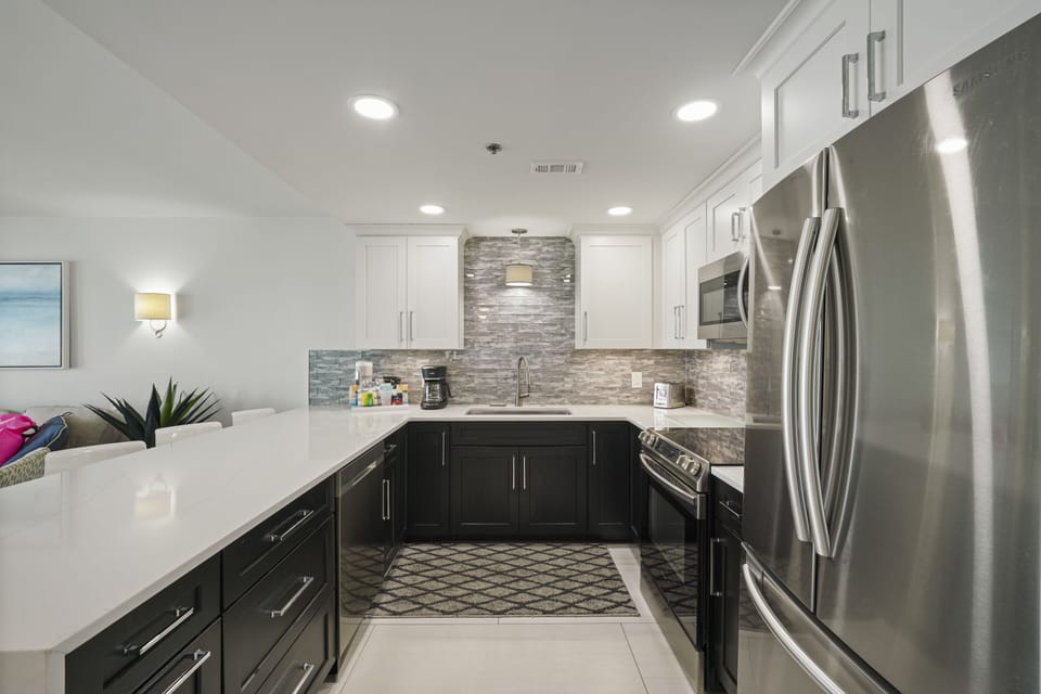 Modern Destin beachfront vacation rental with quartz countertops and stainless appliances.