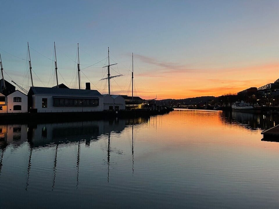 The sun setting over the harbour and the SS Great Britain which is directly opposite the building