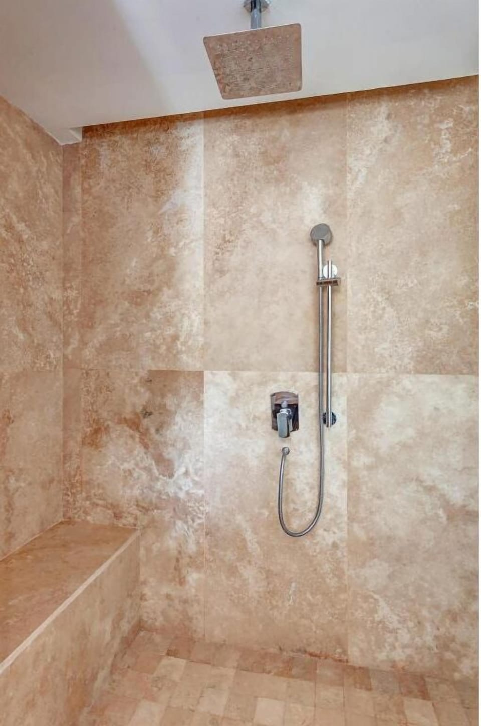 Rinse off under a rainfall shower after sun-soaked adventures.