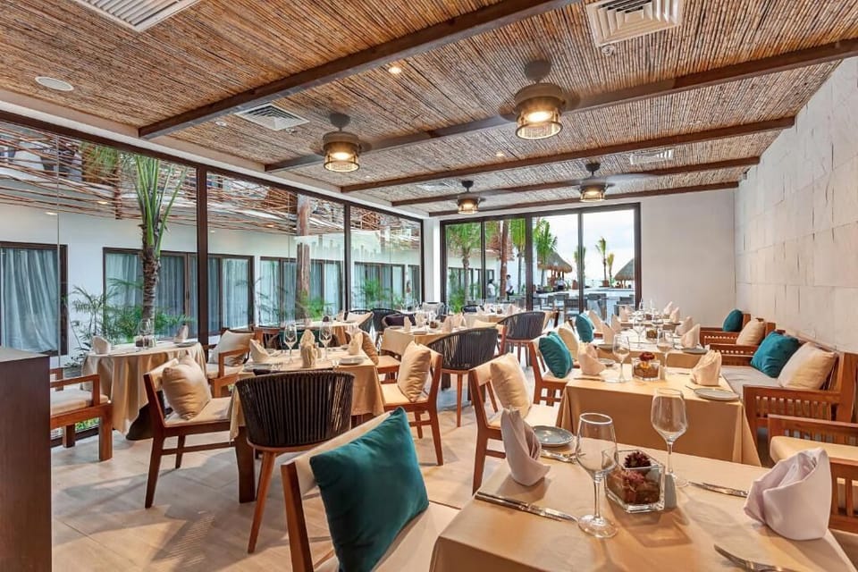 Savor candlelit dinners in breezy, coastal-chic restaurant seating.