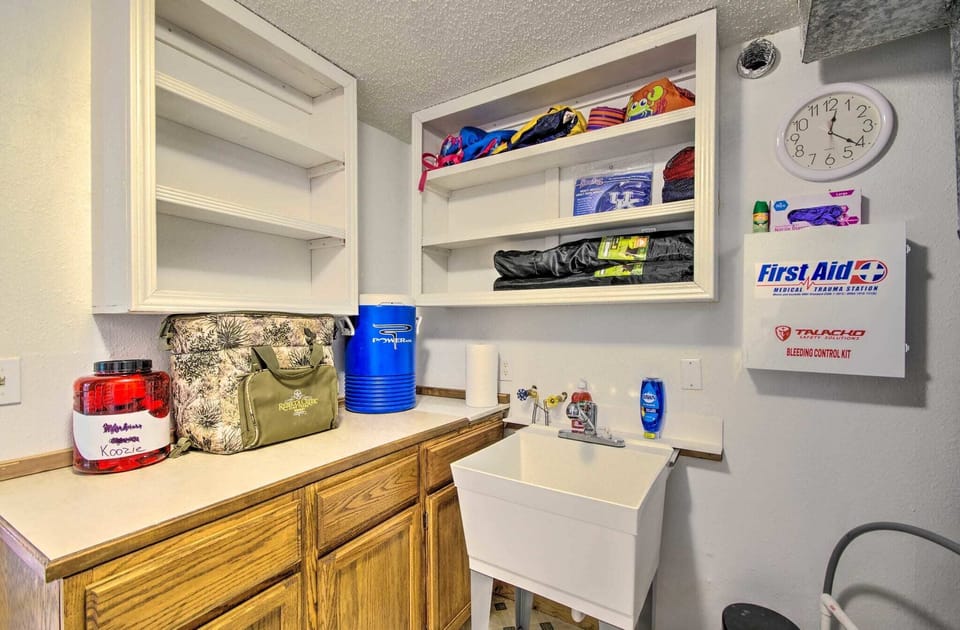 First aid kit, coolers and water cooler located in wash room