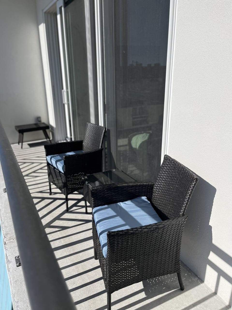 Outdoor patio area to watch the palm trees and unwind from beach day. 