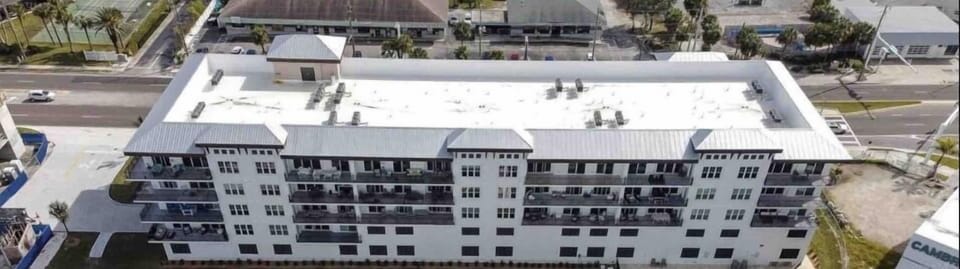 Pool is located behind building facing intercoastal water