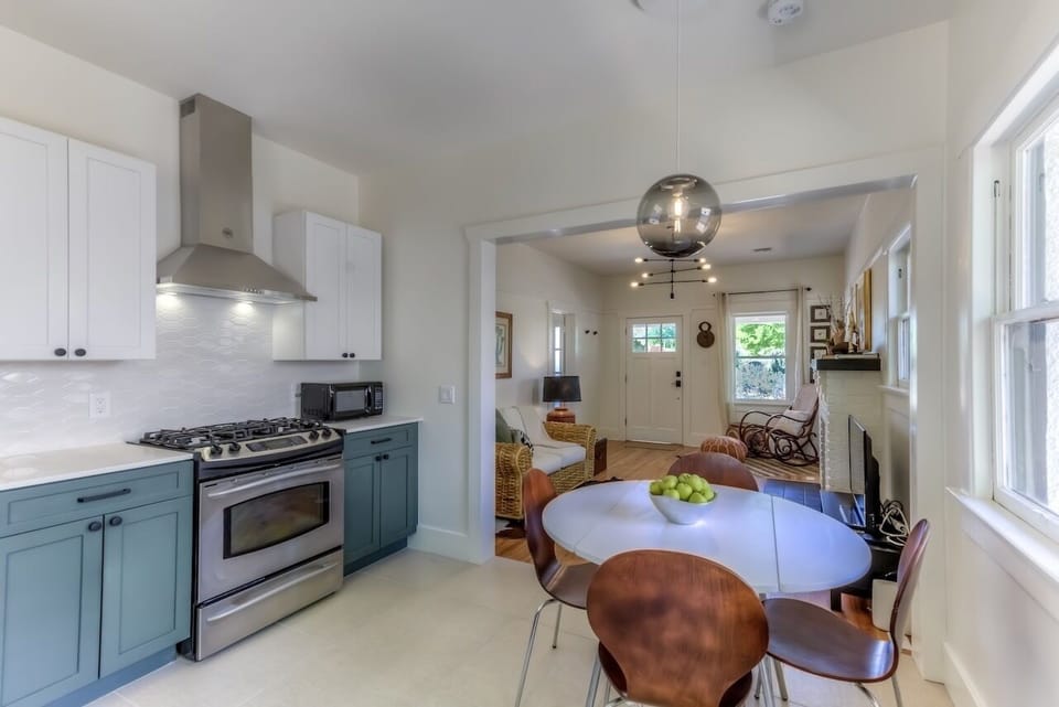 Remodeled open plan kitchen with farmhouse sink, all amenities