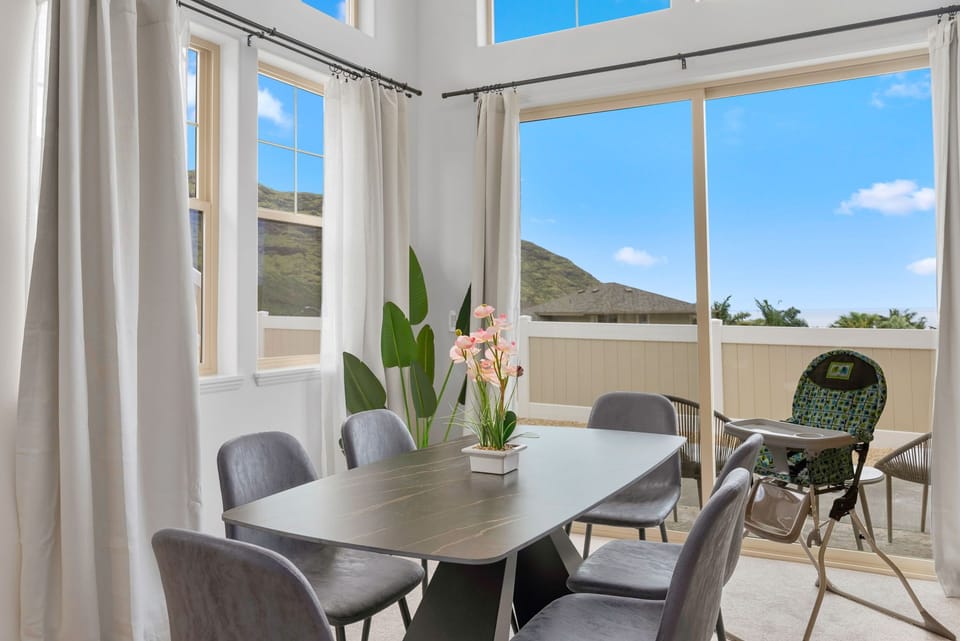 Dining area is surrounded by windows.