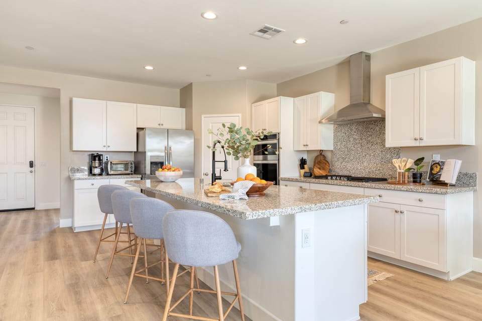 Barstool seating at the large kitchen island.