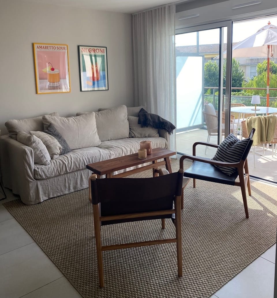 The living room with access to the balcony