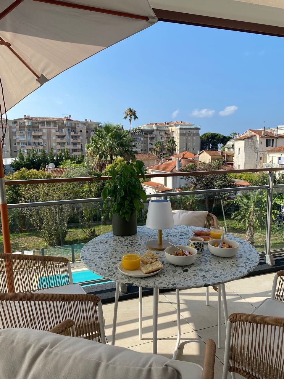 The balcony with the pool in the background