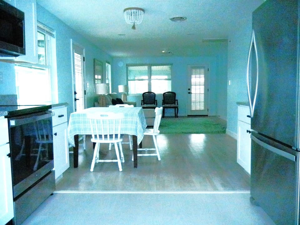 In the kitchen showing dining area and living room