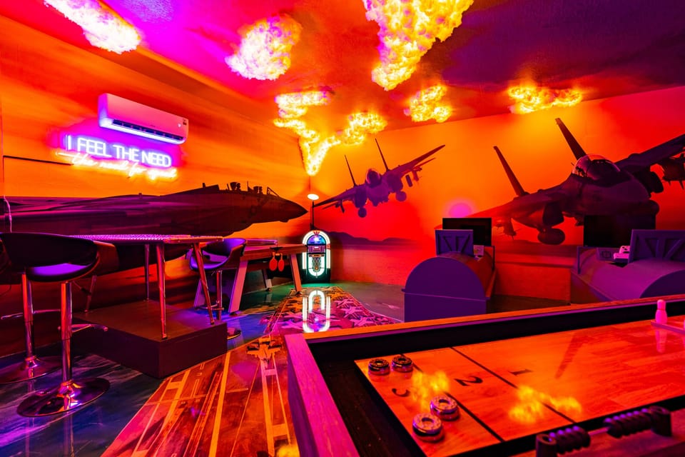 This TOP GUN game room even has 2 custom cock pits for X-boxes!