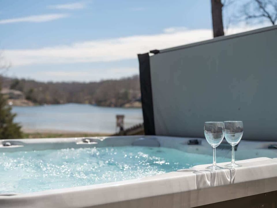 Soak in our private hot tub overlooking Lake Brittany—sip, relax and enjoy the peaceful water view.