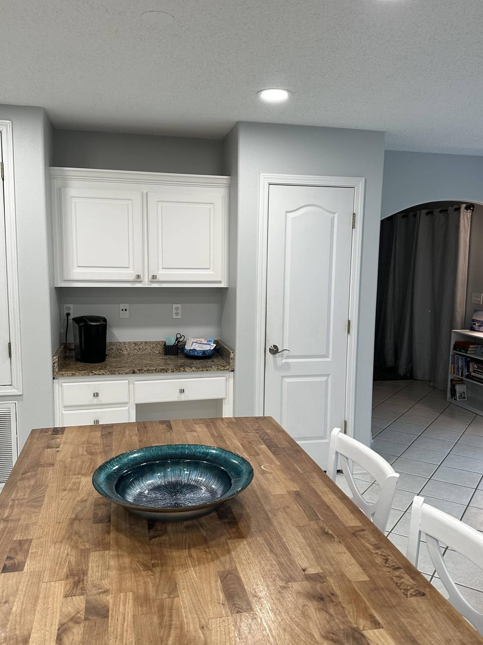Coffee and beverage nook comes with Keurig and cups and basic bar essentials