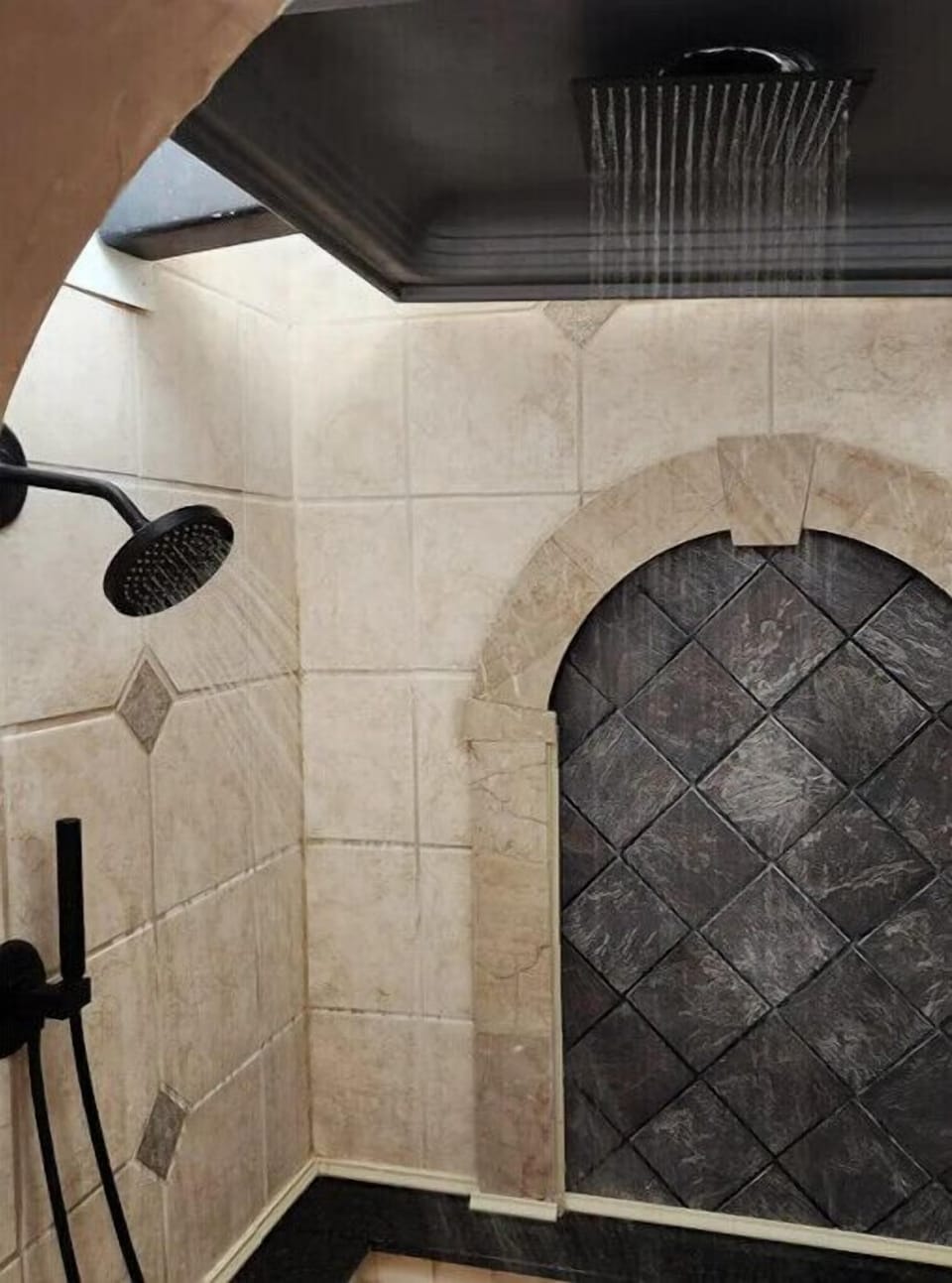 Shower has indirect overhead lighting and optional colored mood lights.