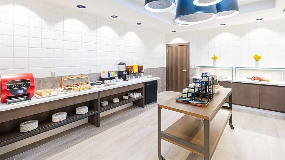Linger over breakfast in a calm, modern dining space.