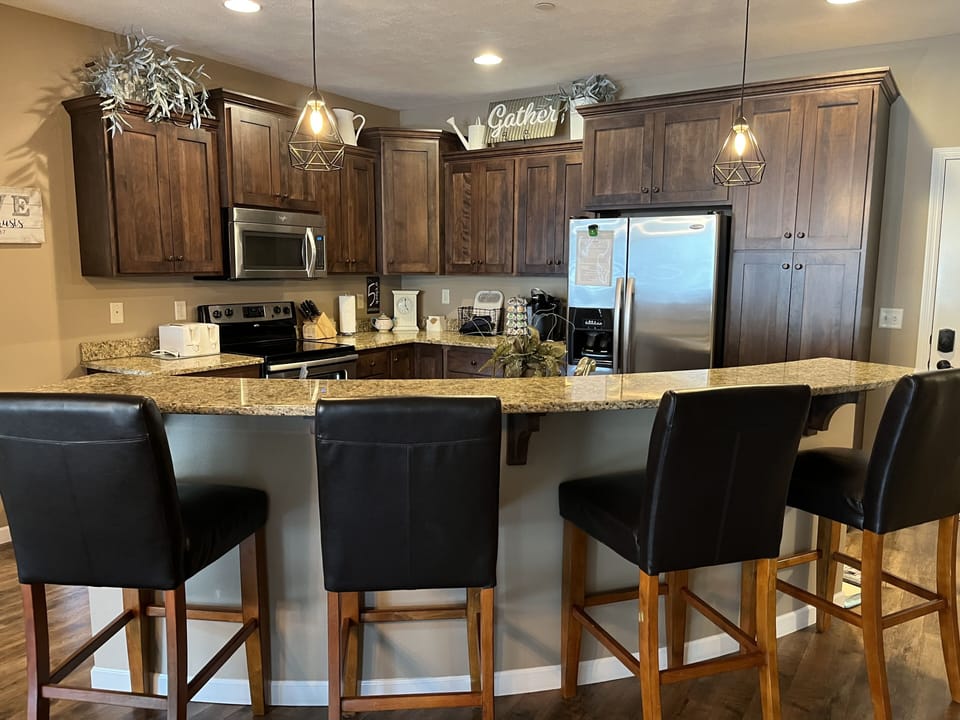 Kitchen with stainless steel appliances, including dishwasher
