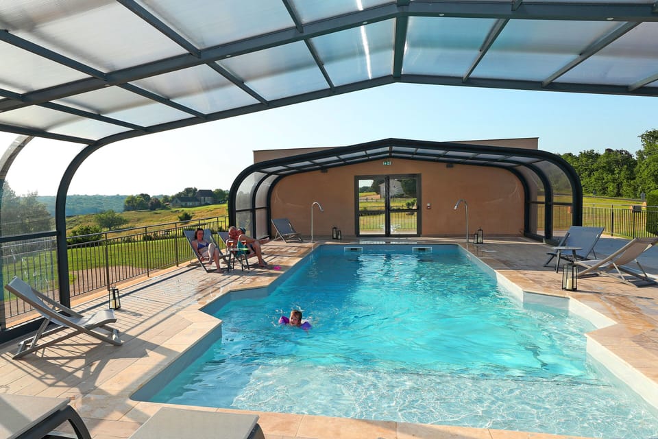 A tranquil indoor pool with a view.
