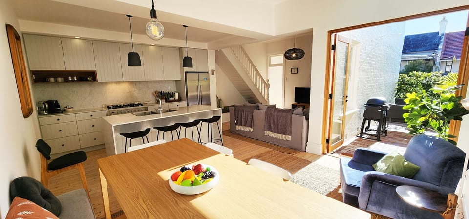 Open plan dining / kitchen with reverse cycle air conditioning.