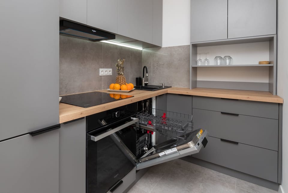 Another perspective of the kitchen, emphasizing the functional layout and built-in appliances.





