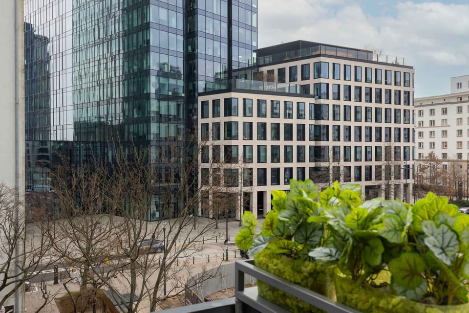 A view showcasing modern city architecture and greenery.
