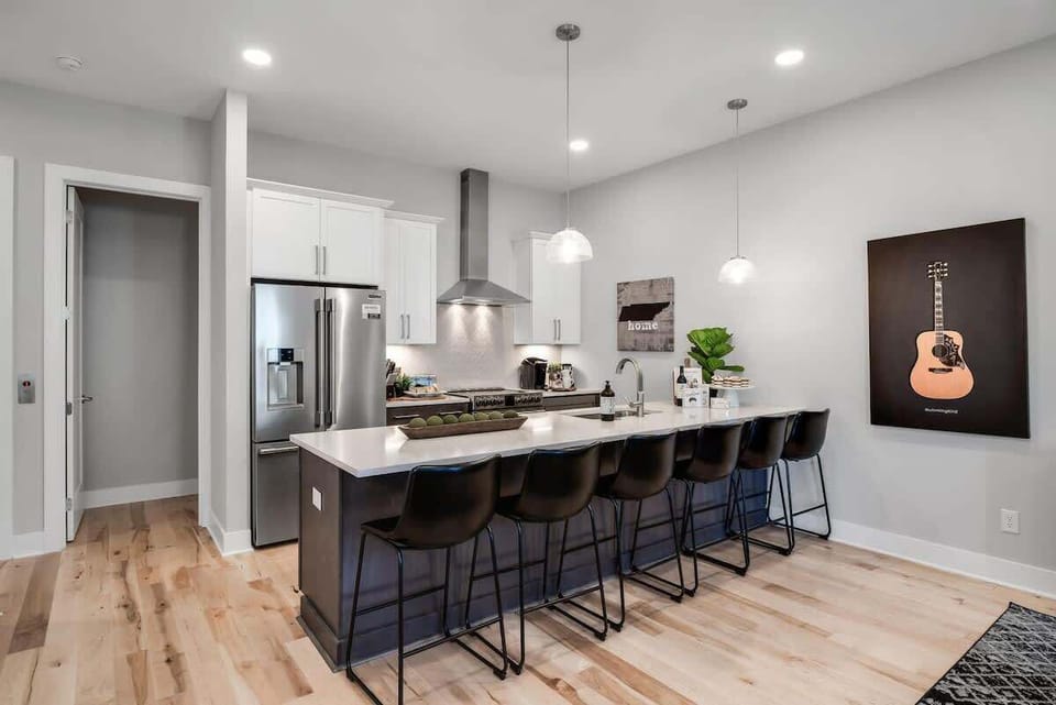 Fully stocked kitchen with a 6-seater island for meal prep and hangouts.