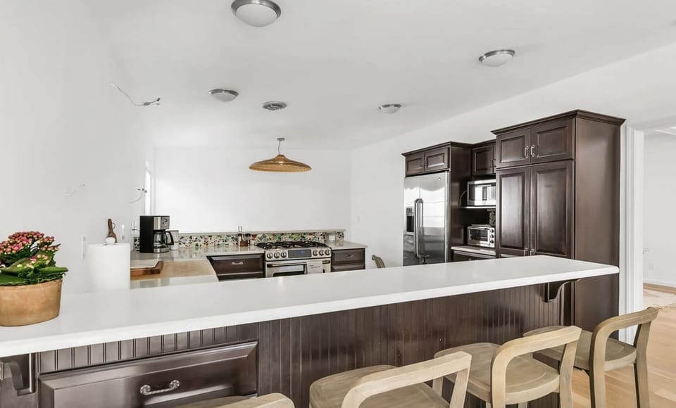 Eat in kitchen w new open shelves and spacious table on far side