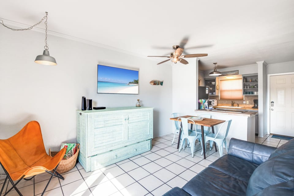 Relax in your bright, open-concept space with coastal vibes, modern kitchen, and comfortable seating perfect for beach getaway memories.