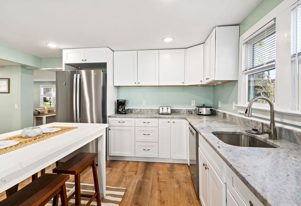 Gleaming Granite Countertops and Stainless Appliances.