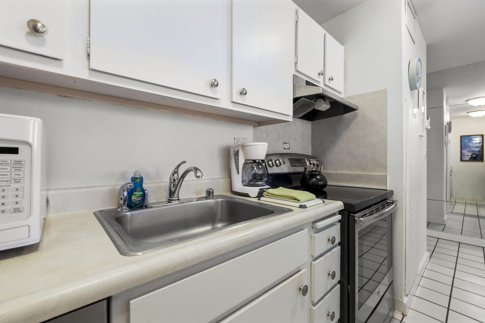 Your fully equipped kitchen includes everything you need to prepare meals during your stay, from the stove and microwave to a deep sink and ample counter space.