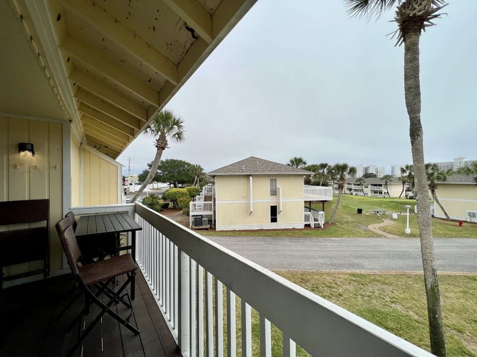 Sip your morning coffee on your private balcony, watching palm trees sway while the coastal breeze carries ocean scents through the tropical setting.