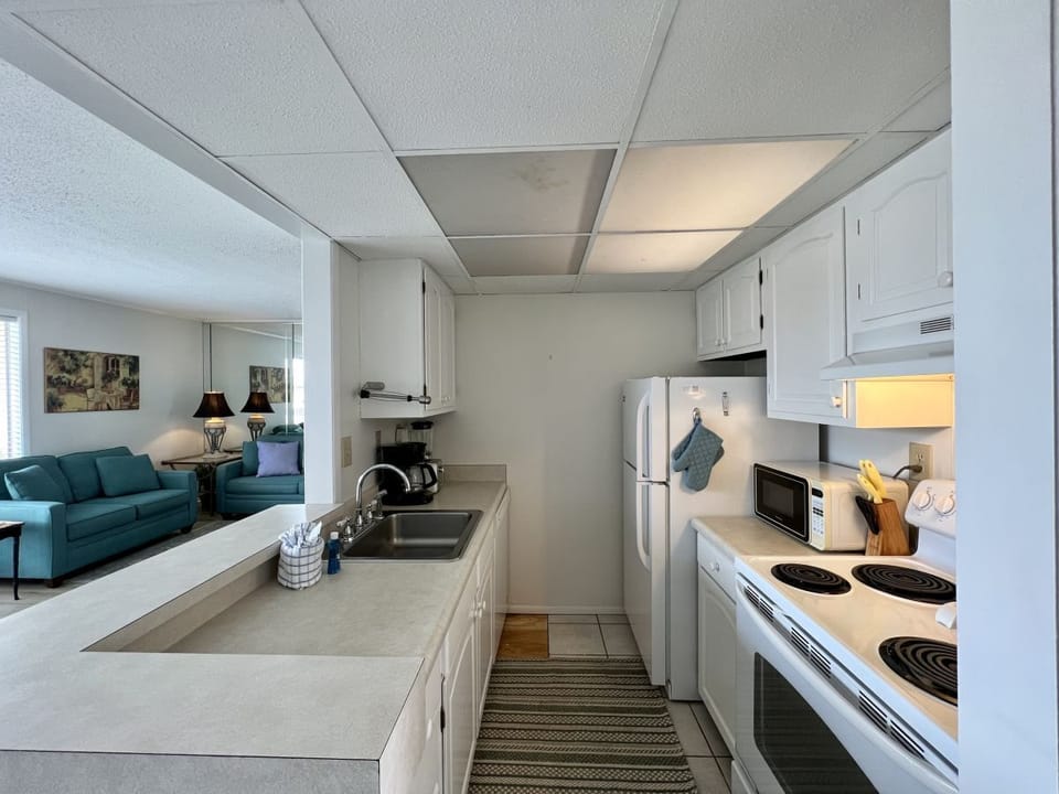 Your fully equipped kitchen offers everything you need to prepare meals during your stay, with modern appliances and ample counter space.