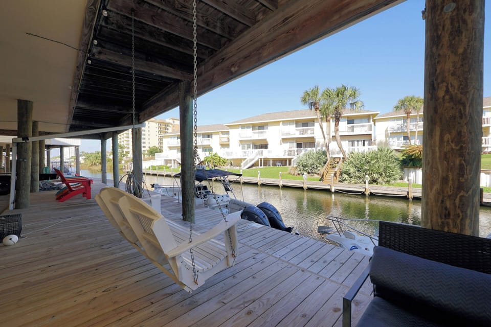 Unwind on your private waterfront deck with canal views, a porch swing, and boats at your doorstep for endless aquatic adventures.