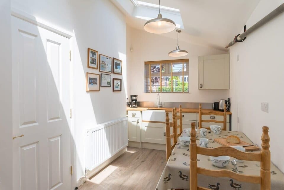 Breakfast room has sink, fridge, kettle, toaster - it's a rowing themed room complete with rowing oar on the wall!