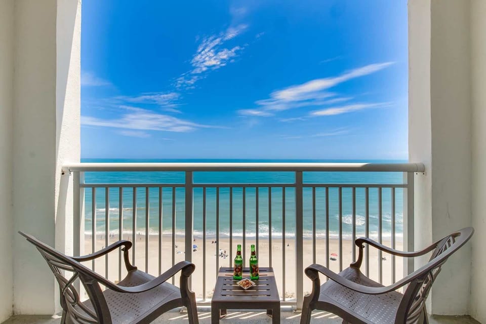 Unwind on your private balcony with uninterrupted ocean views! Enjoy your morning coffee or evening drinks while soaking in the serene beach vibes and the sound of crashing waves. Your perfect seaside retreat awaits!