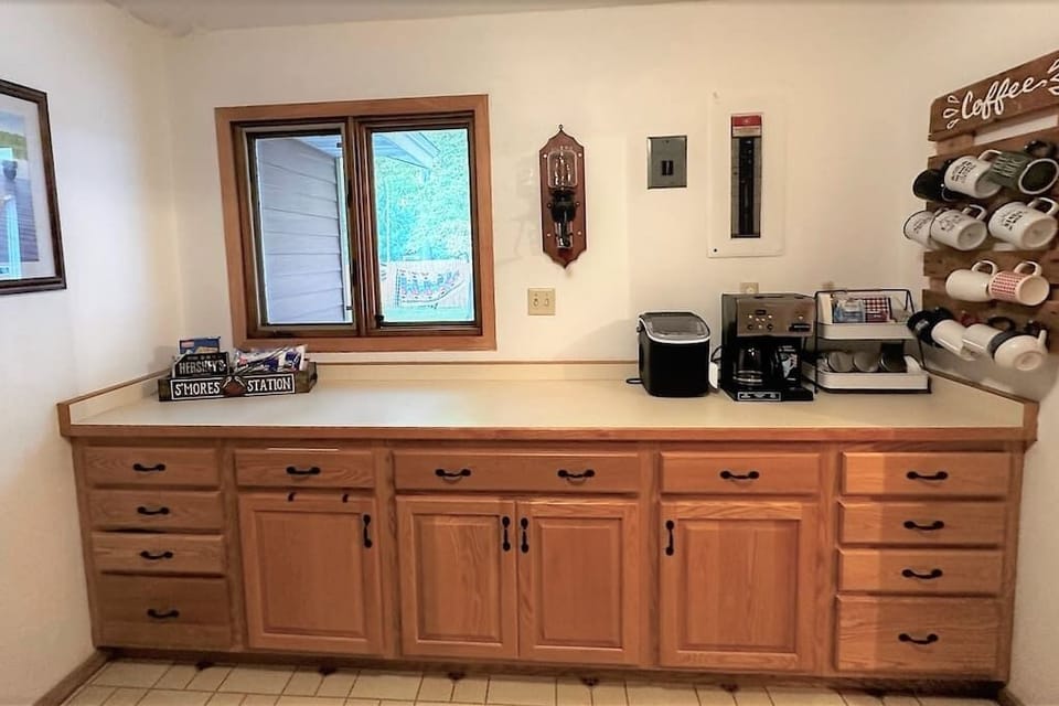 Hallway between rec room and kitchen.  Home of coffee & tea bar. 